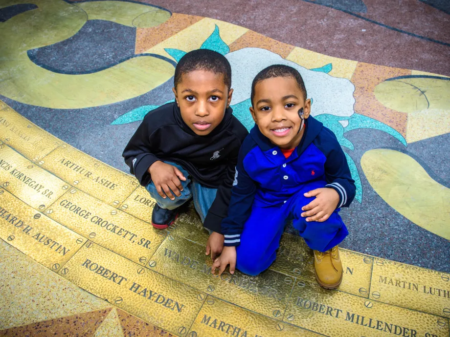 Boys pose on the Ring of Genealogy